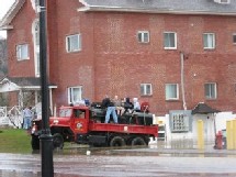 Photograph of people being rescued from flooding on Main Street on April 30, 2008