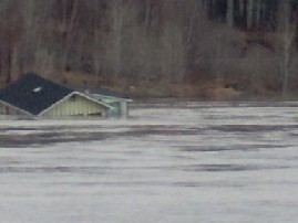 Photograph of a home flooded along the St. John River in Fort Kent, ME on April 30, 2008