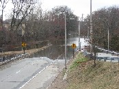 Photograph of flooding of the Pawtuxet River on the Route 5 On-Ramp in West Warwick, RI