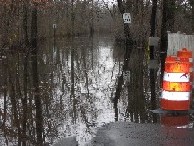 Photograph of the Sudbury River flooding Pelham Island Road in Wayland, MA