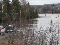 Photograph of a flooded road in Northern Maine on April 30, 2008