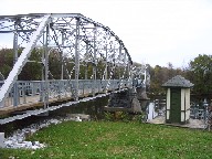 Photograph of the Missisquoi River at Swanton, VT (SWAV1) gage house and bridge bike trail