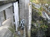 Photograph of the West Hill Dam staff gage on the West River
