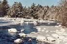 Photograph of river ice along the Black River in Boonville, NY in December 2002 looking upstream