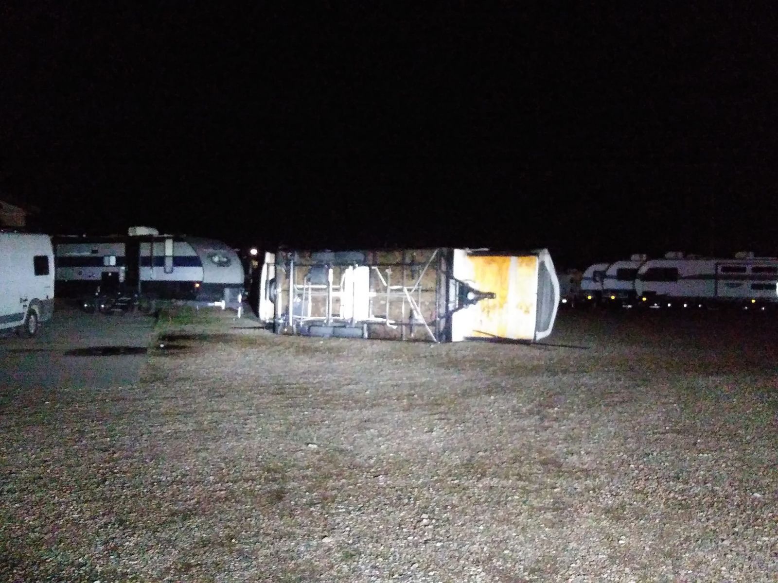 RV trailer tipped over. Photo credit KCCR Pierre.
