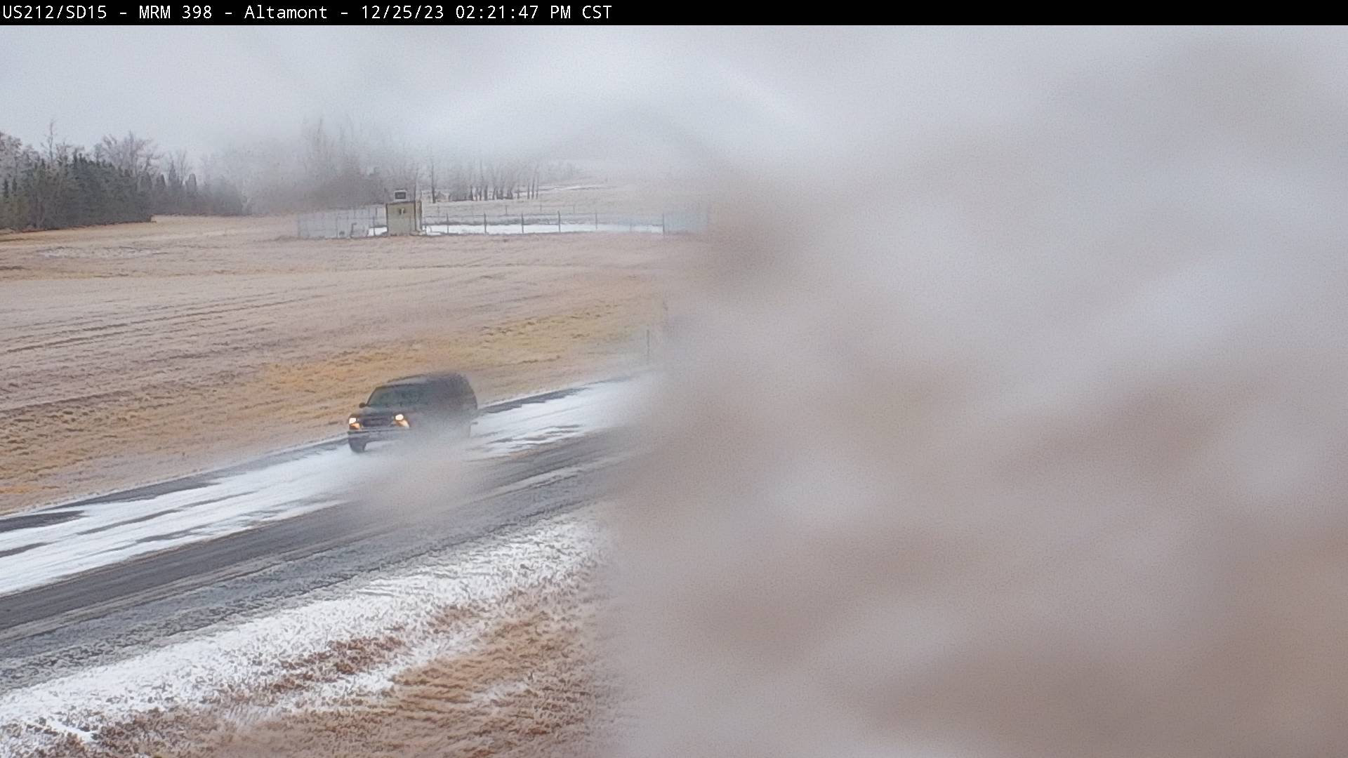 Ice on the webcam on US-212 near Altamont, SD at 2:21pm CST on December 25, 2023 (via SDDOT)