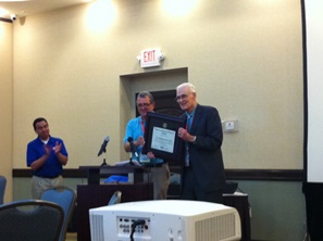 Dr. Bill Gray receiving the First Robert and Joanne Simpson Award for Outstanding Contributions to  Tropical Meteorology