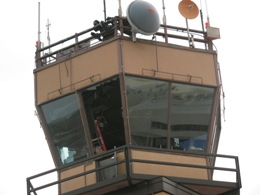 photo of photo of the Harlingen/Valley International Airport control tower with windows knocked out (click to enlarge)