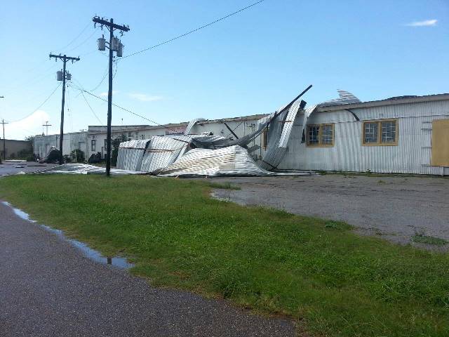 Tin roof ripped from portion of warehouse along Business 83 in east Weslaco, June 2 2013