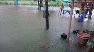 Standing water one foot deep covers a backyard and patio near Edinburg during peak of Friday, June 19th 2015 deluge