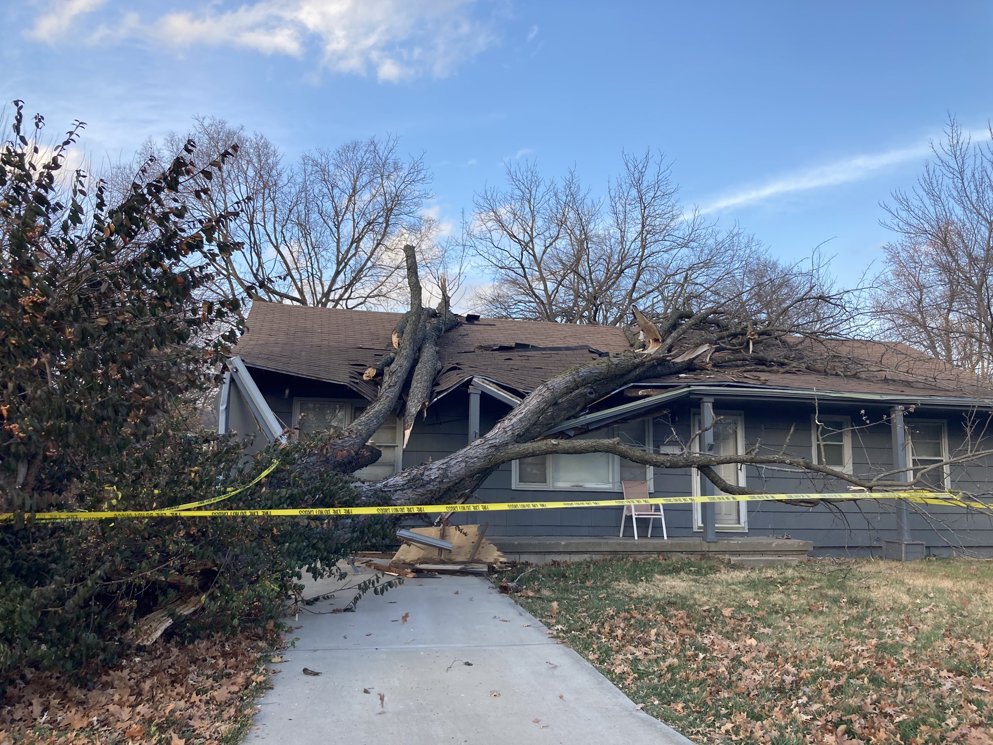 Photo of tree fallen on house in Overland Park. Damage occurred ahead of evening thunderstorms.