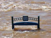 [ River Walk sign nearly submerged ]