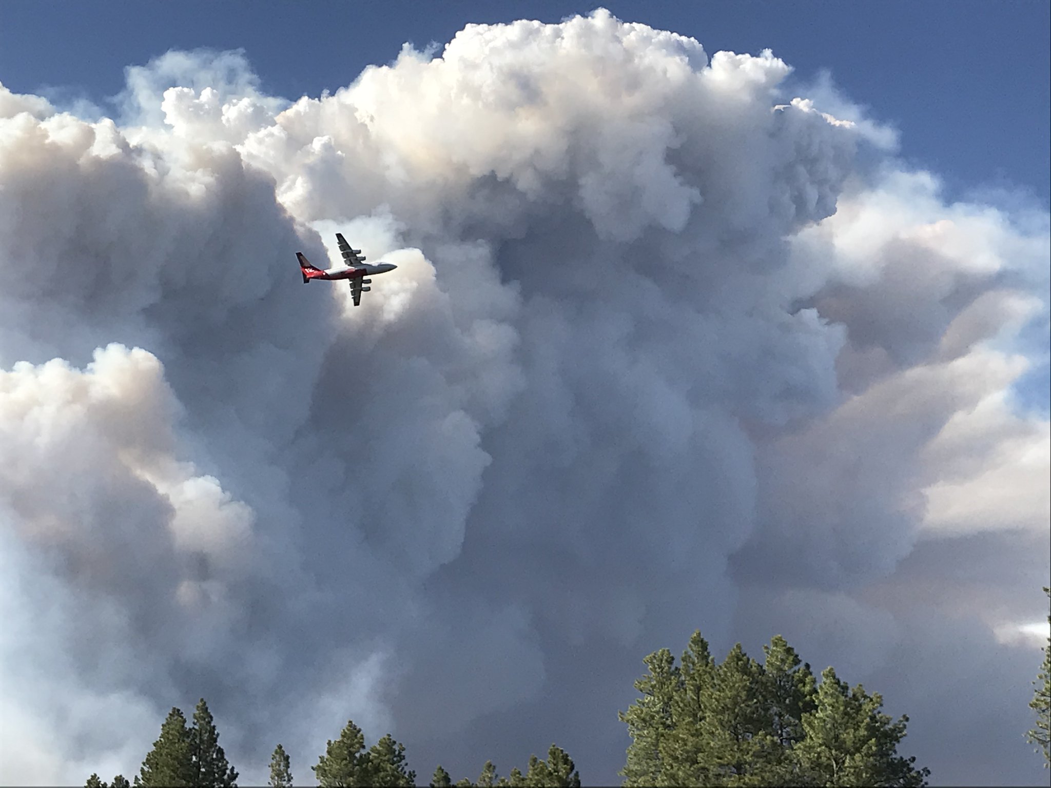 Very large air tanker flies past smoke column for the Mangum Fire June 12, 2020. Photo Credit: Kaibab National Forest