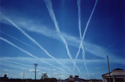 Image of contrails across the sky.
