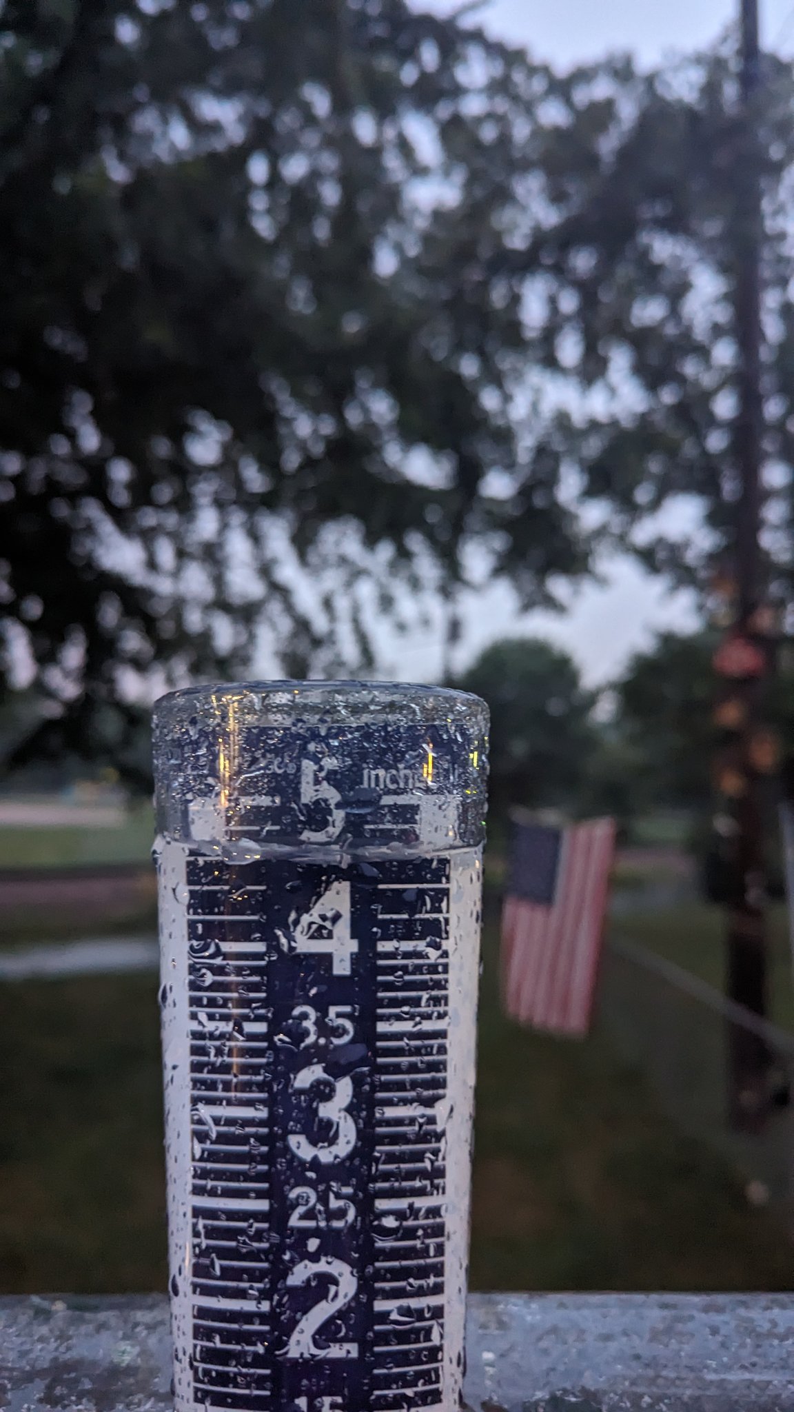 Rain gauge showing between 4 and 5 inches of rainfall.
