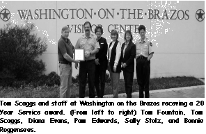 A picture of Mr Tom Scaggs and the staff at Washington on the Brazos receiving a 20 year service award from Tom.
