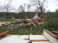 An unanchored building was destroyed, and several trees were downed