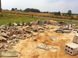 A stone house that was razed along Skaggs Rd.  Another home down the street was also leveled.  