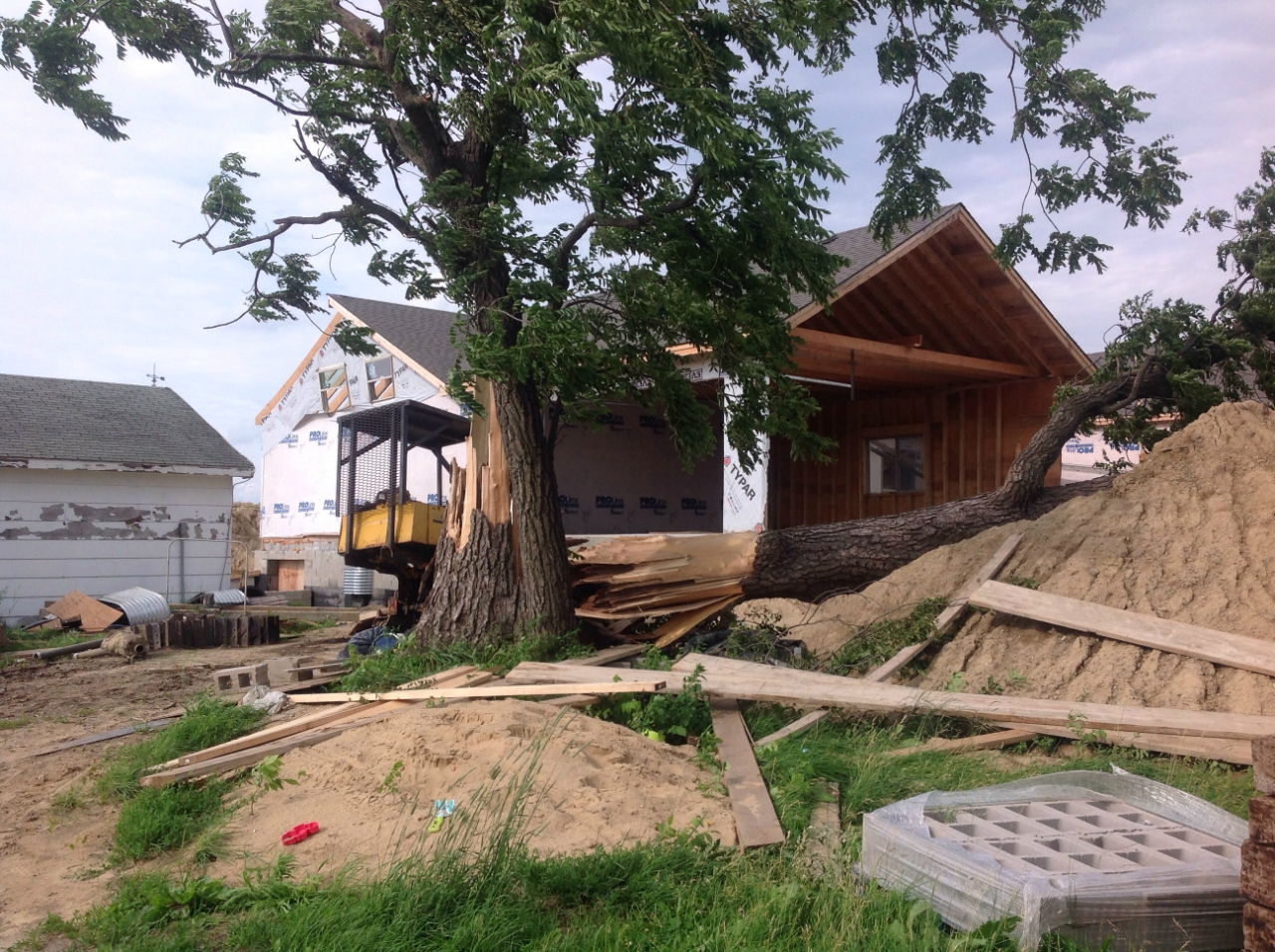 Photo showing damage from a tornado near Grant Park. Walls have collapsed at a building under construction.