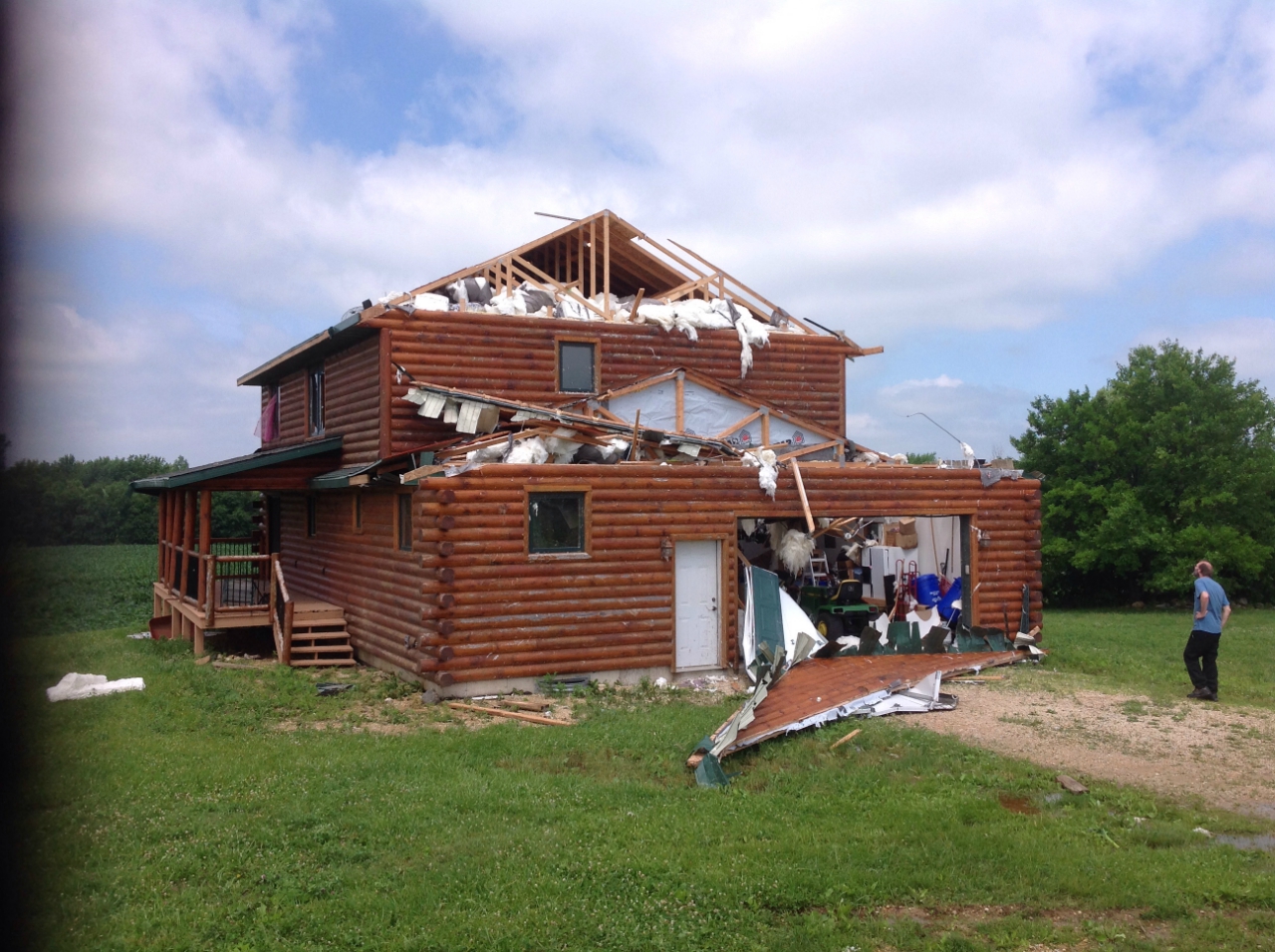 Photo showing damage to a house from the West Brooklyn tornado