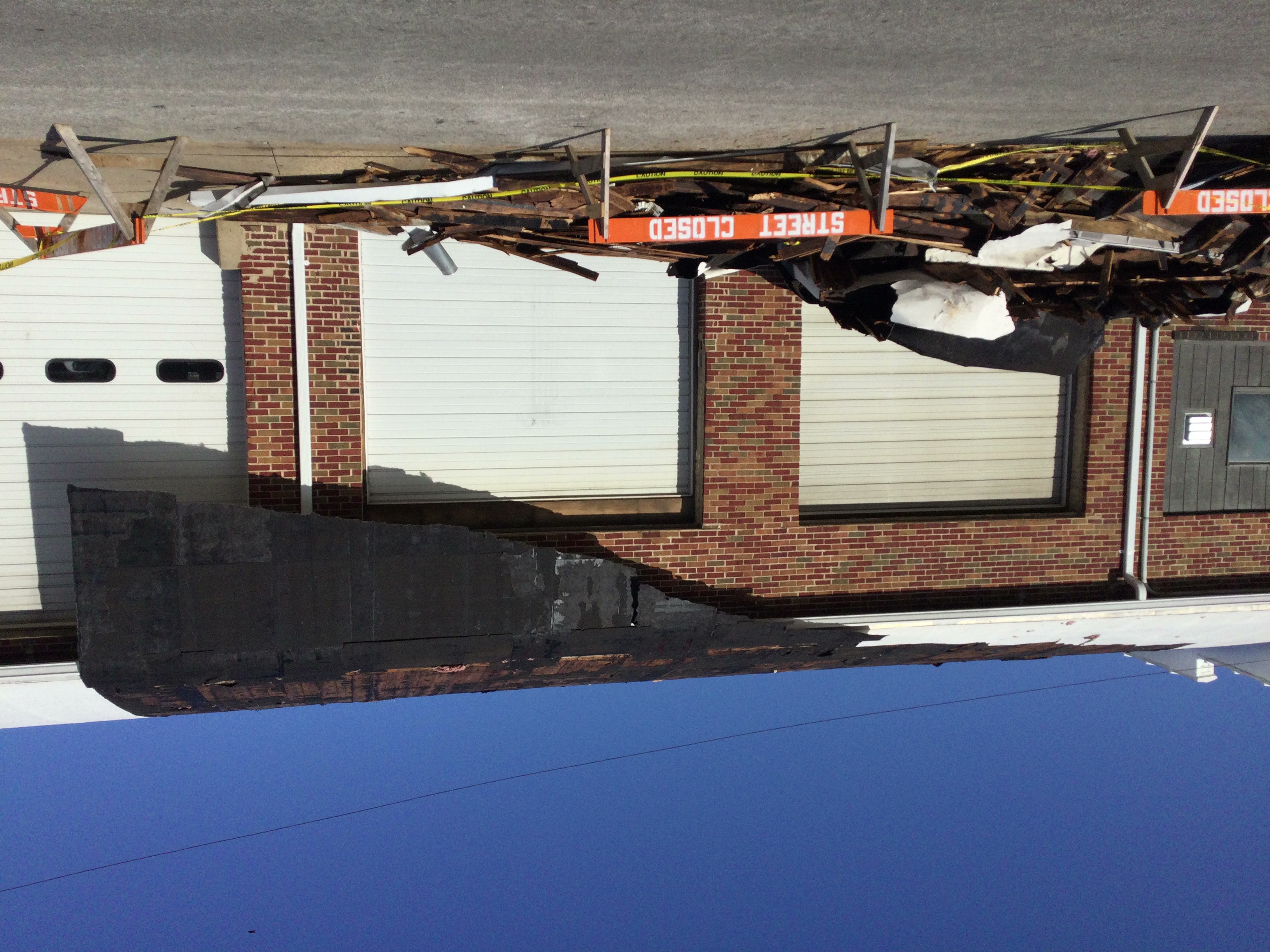 Photo of damage to the roof of a business in Sullivan, MO.