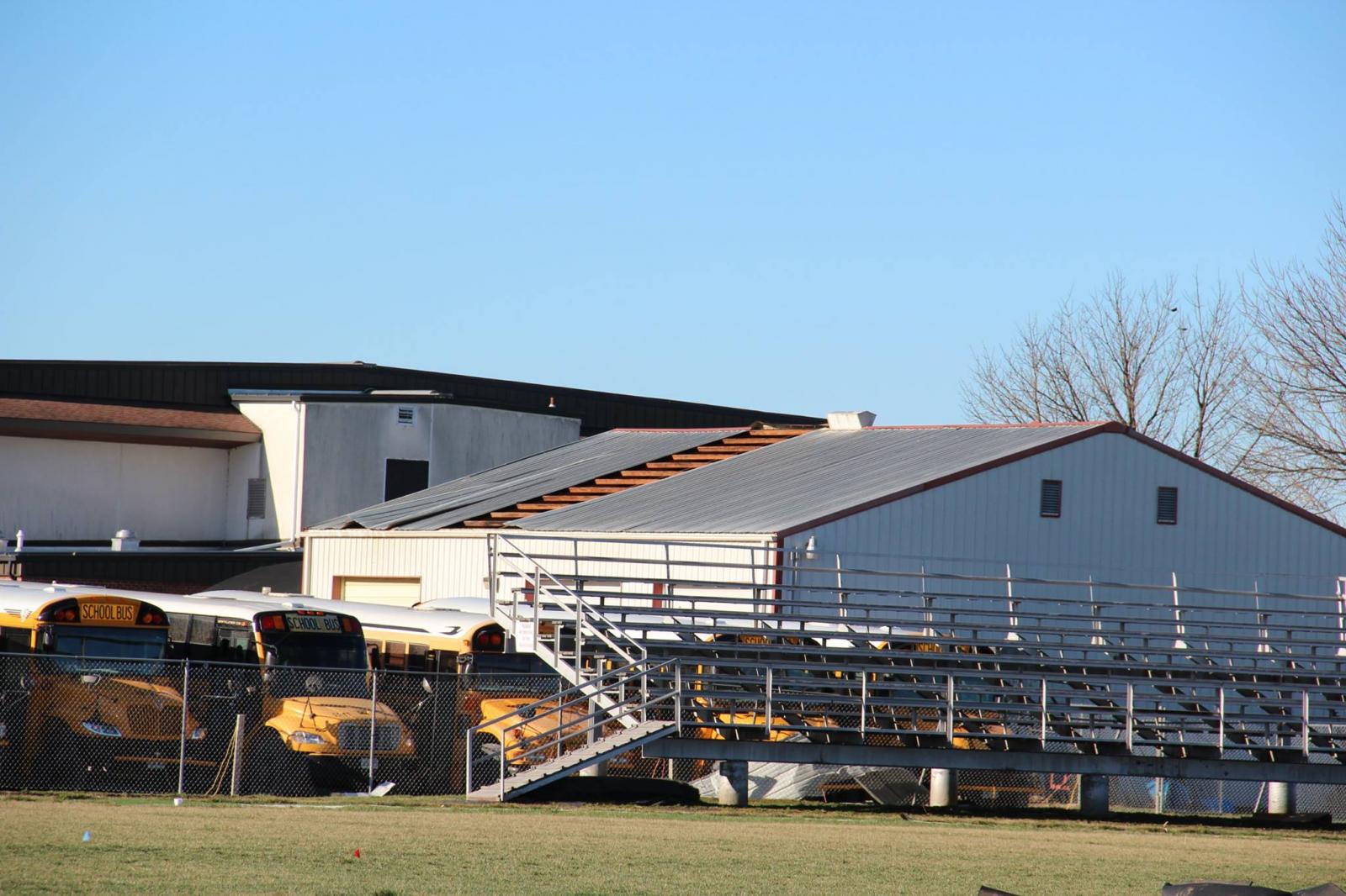 Photo of partial roof damage to an outbuilding at South Shelby High School.