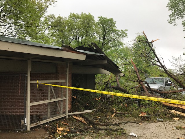Photo of damage to a house from fallen tree.