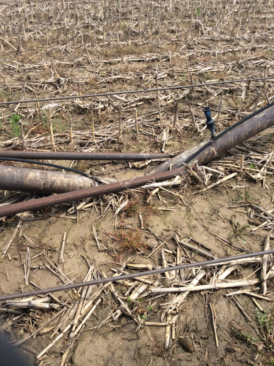 Photo of a damaged field irrigator.