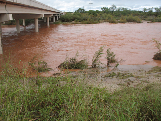 A closeup of the swollen South Fork of the Double Mountain Fork of the Brazos River flowing under a bridge along U.S. 84 near Justiceburg. (Photographs taken by John Lipe and Marty Mullen, NWS Lubbock) 