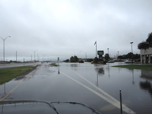 View of flooding along the access road of south Loop 289 - click to enlarge the image