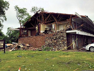 Following a high end weak tornado (rated EF1), the wall of an apartment collapsed with with interior rooms exposed on the east side of Pine Bluff (Jefferson County) on 05/08/2019.