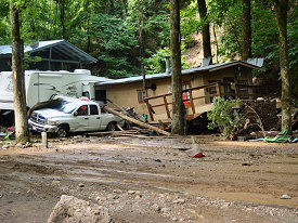 Property damage was extensive, with numerous cabins and vehicles affected.