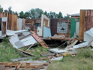 Northwest of Joy (White County), a mobile home was heavily damaged. The structure was unoccupied and was being renovated.