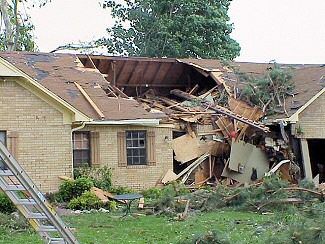 The roof of a home was partially ripped off in McCrory (Woodruff County).