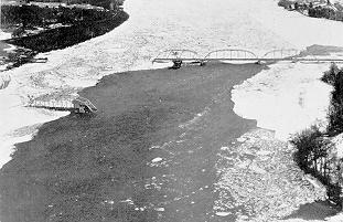 Image of a highway bridge destroyed by ice flows on the Kennebec River in Maine, March 1936.