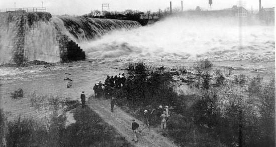 Picture of Holyoke Power Dam with nearly 15 feet of water flowing over its top (at peak flow during the November 1927 flood).