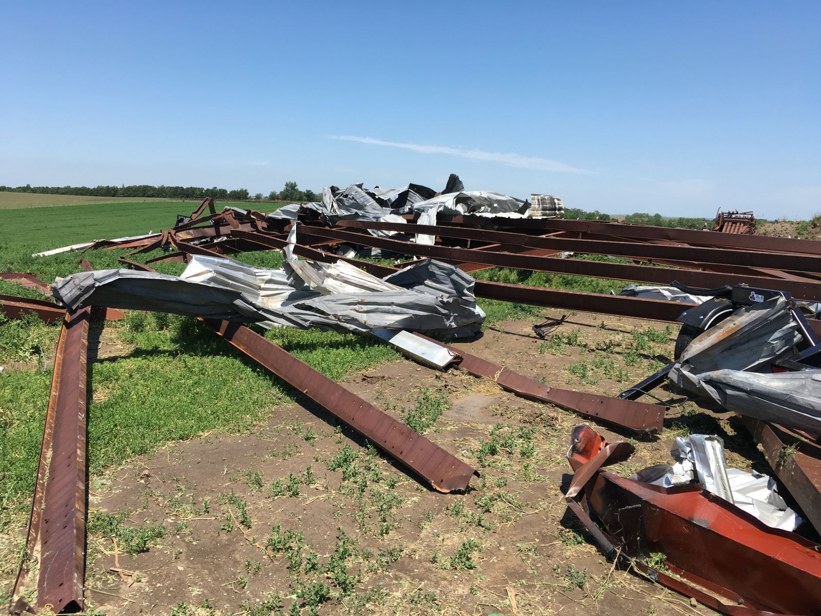 Open-sided hay barn demolished by the tornado.