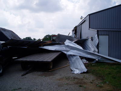 Photo of extensive damage to outbuildings 