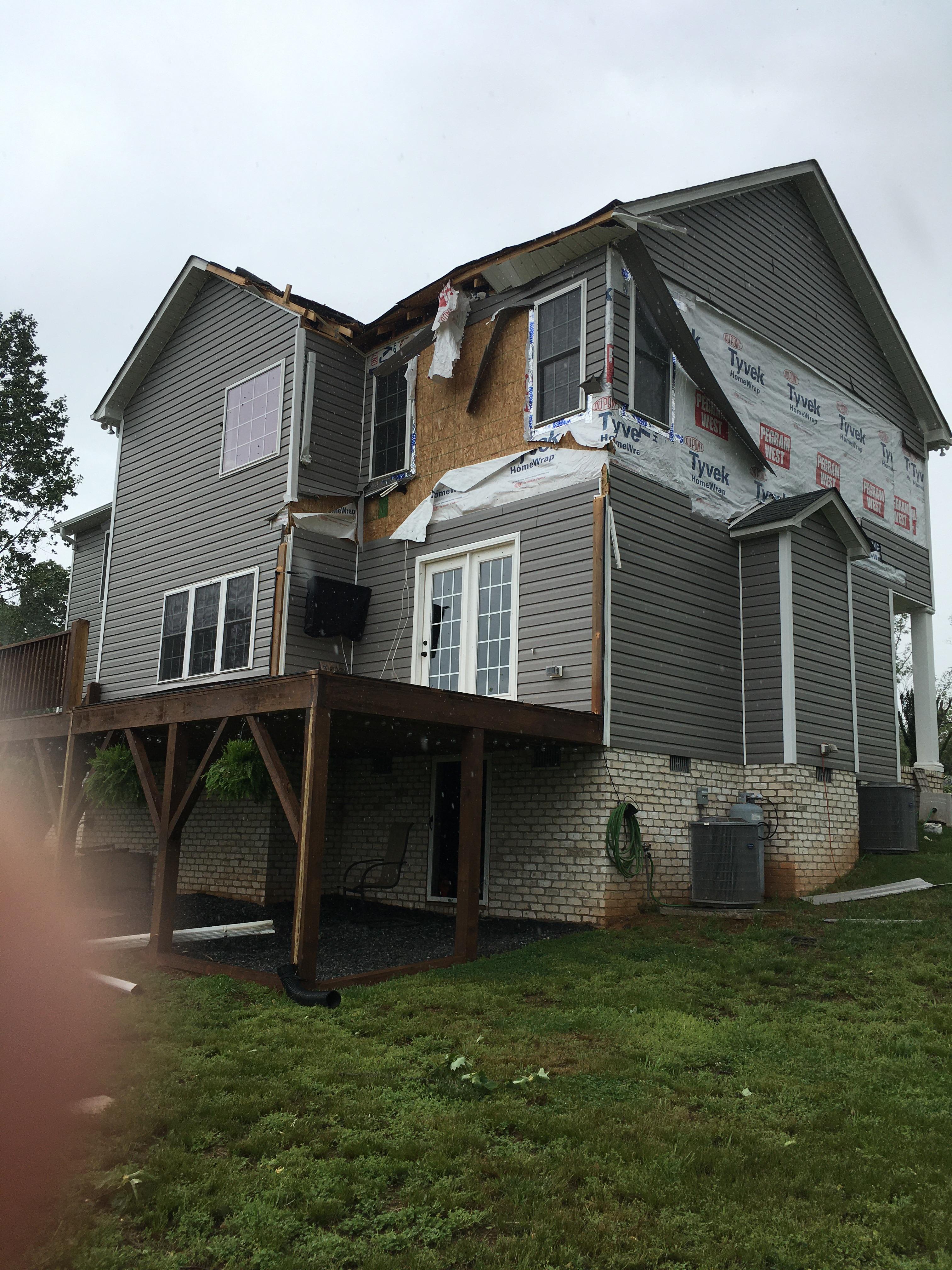 Partial roof and siding damage at home near Sunset View Road