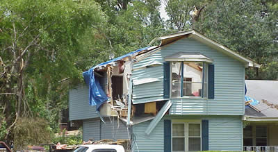 A tree fell on this house injuring a person inside