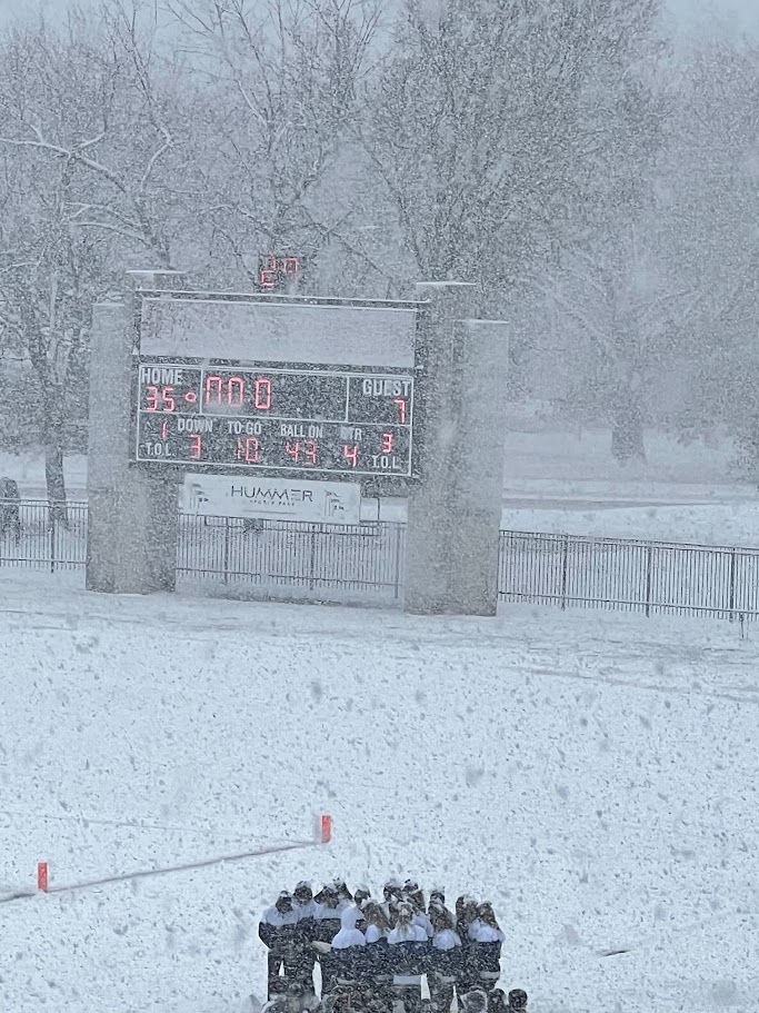 Heavy snow in Topeka at a high school state football playoff game.
